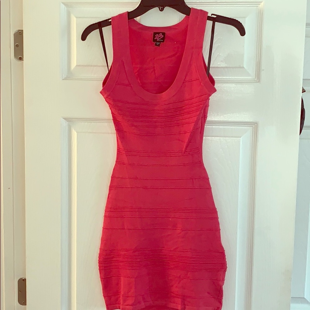 Never been worn Coral Bebe Dress.